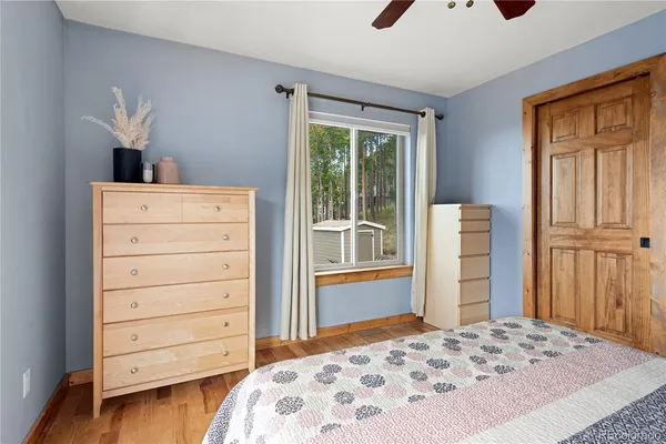 a bedroom with a bed and a dresser