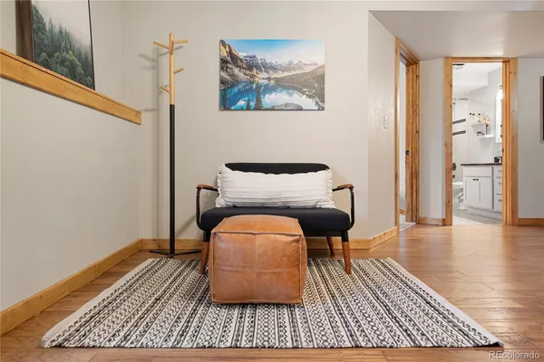 a room with wooden floor and furniture