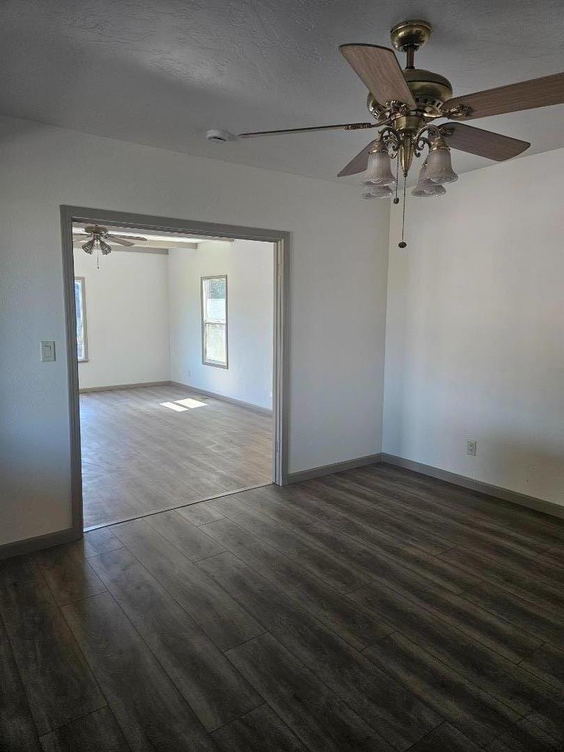 120 Trafton Road Watsonville, CA 95076 - Photo 13 of 43 a view of a room with wooden floor and a ceiling fan