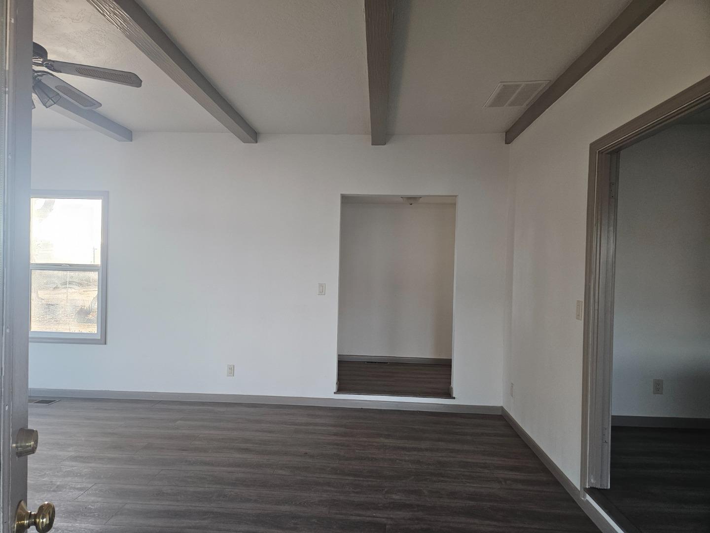120 Trafton Road Watsonville, CA 95076 - Photo 18 of 43 a view of an empty room with wooden floor and a window