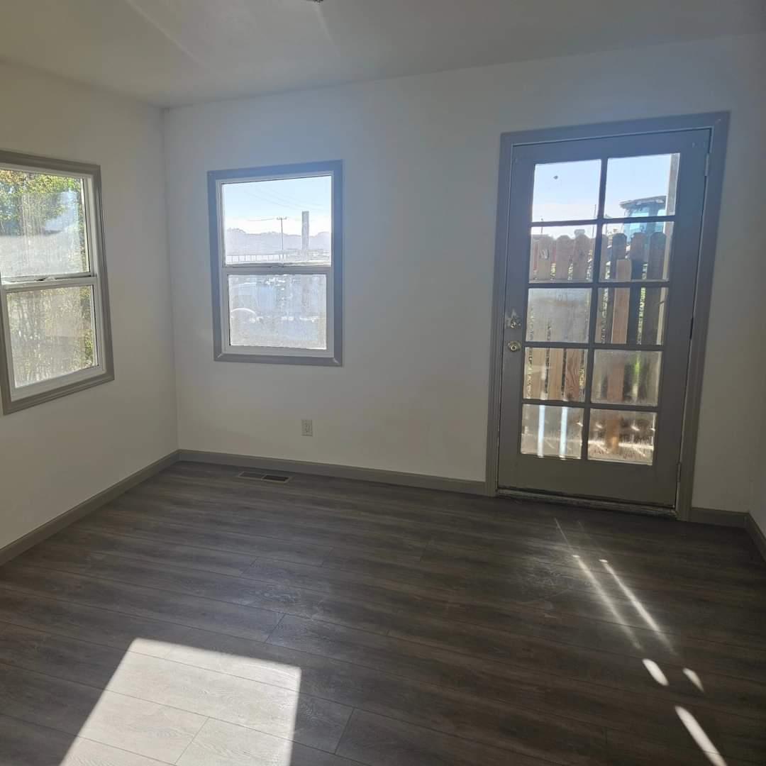 120 Trafton Road Watsonville, CA 95076 - Photo 23 of 43 a view of an empty room with wooden floor and a window