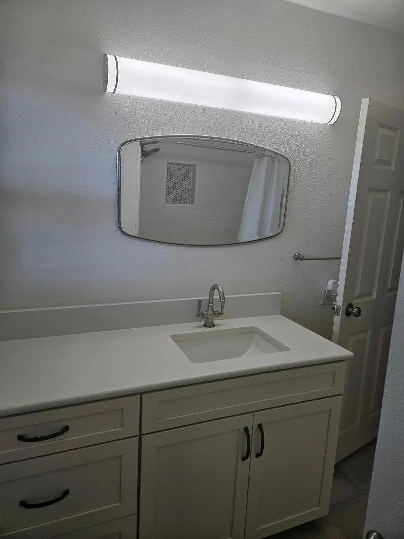 120 Trafton Road Watsonville, CA 95076 - Photo 9 of 43 a bathroom with a sink and a mirror