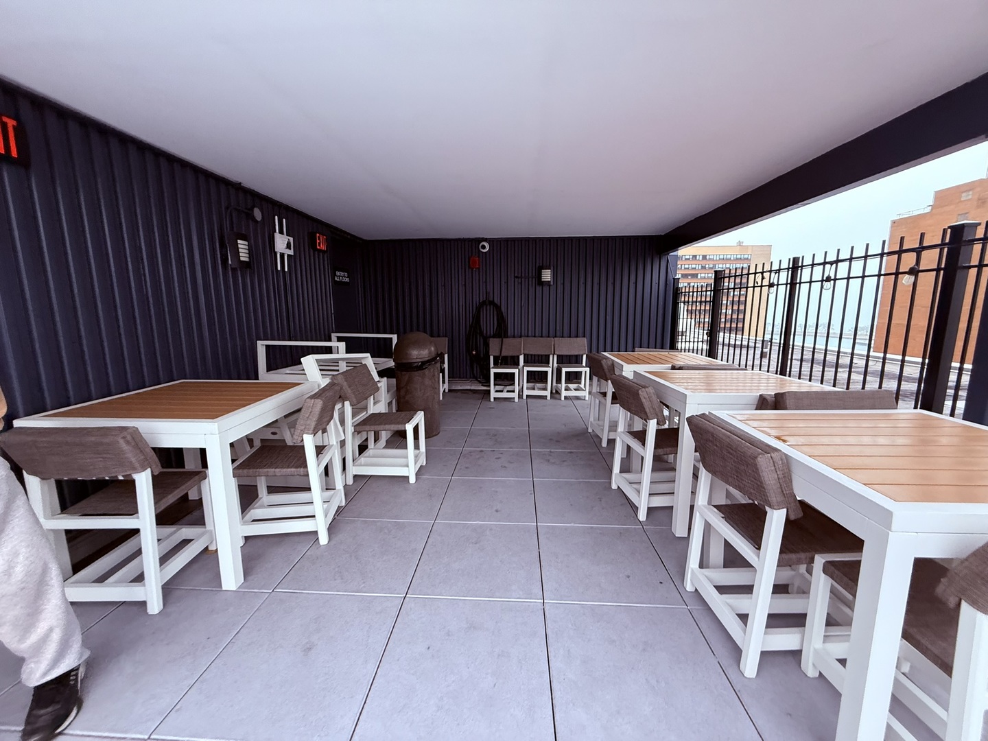 3033 North Sheridan Road, Unit 809 Chicago, IL 60657 - Photo 12 of 20 a view of a patio with table and chairs