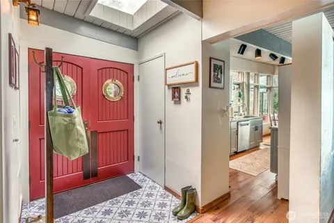 a view of an entryway with wooden floor