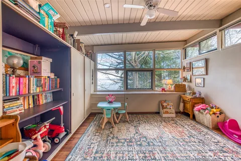 a room with furniture and a book shelf