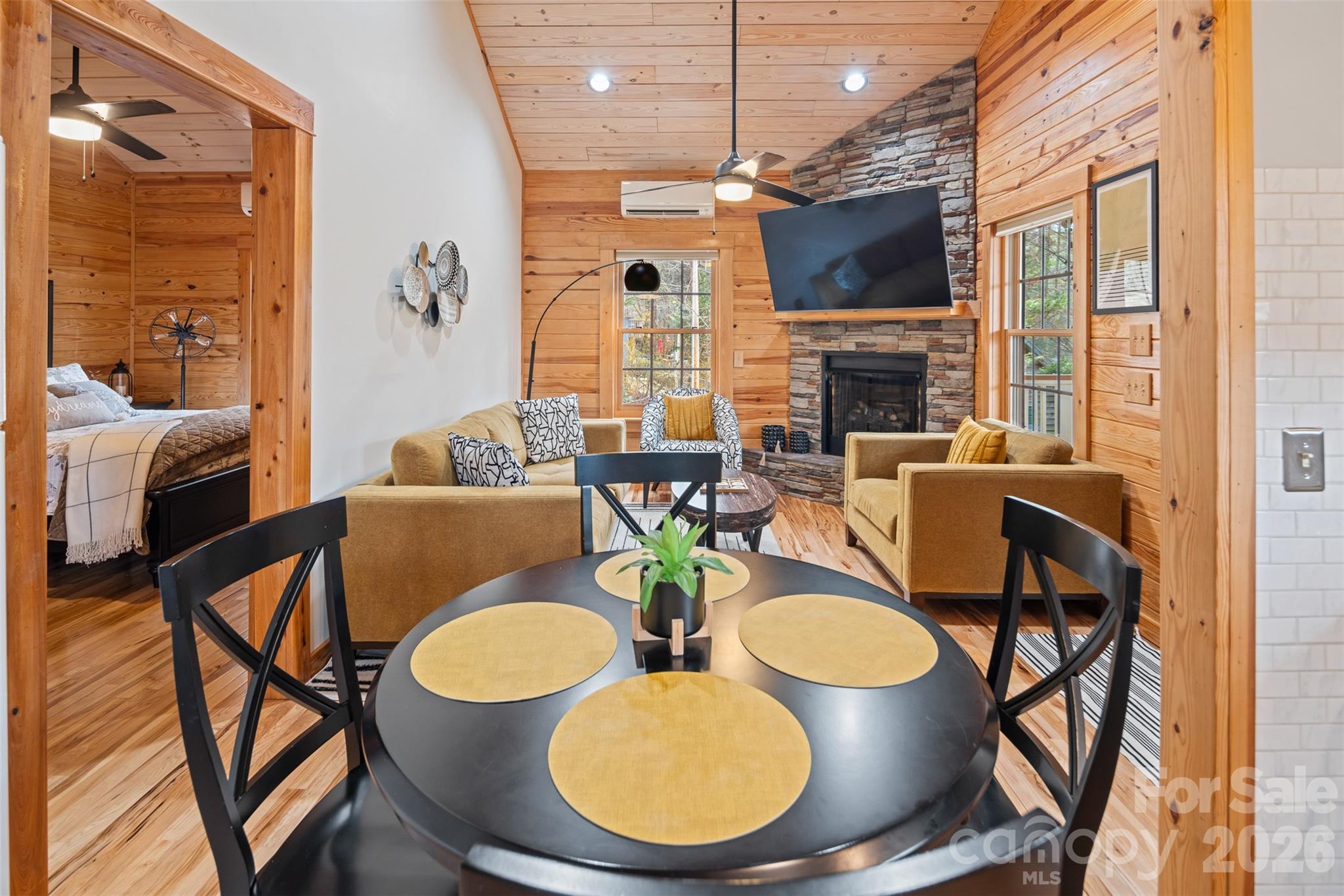 1333 Park Vista Road West Jefferson, NC 28694 - Photo 15 of 39 a view of a dining room with furniture a fireplace and wooden floor