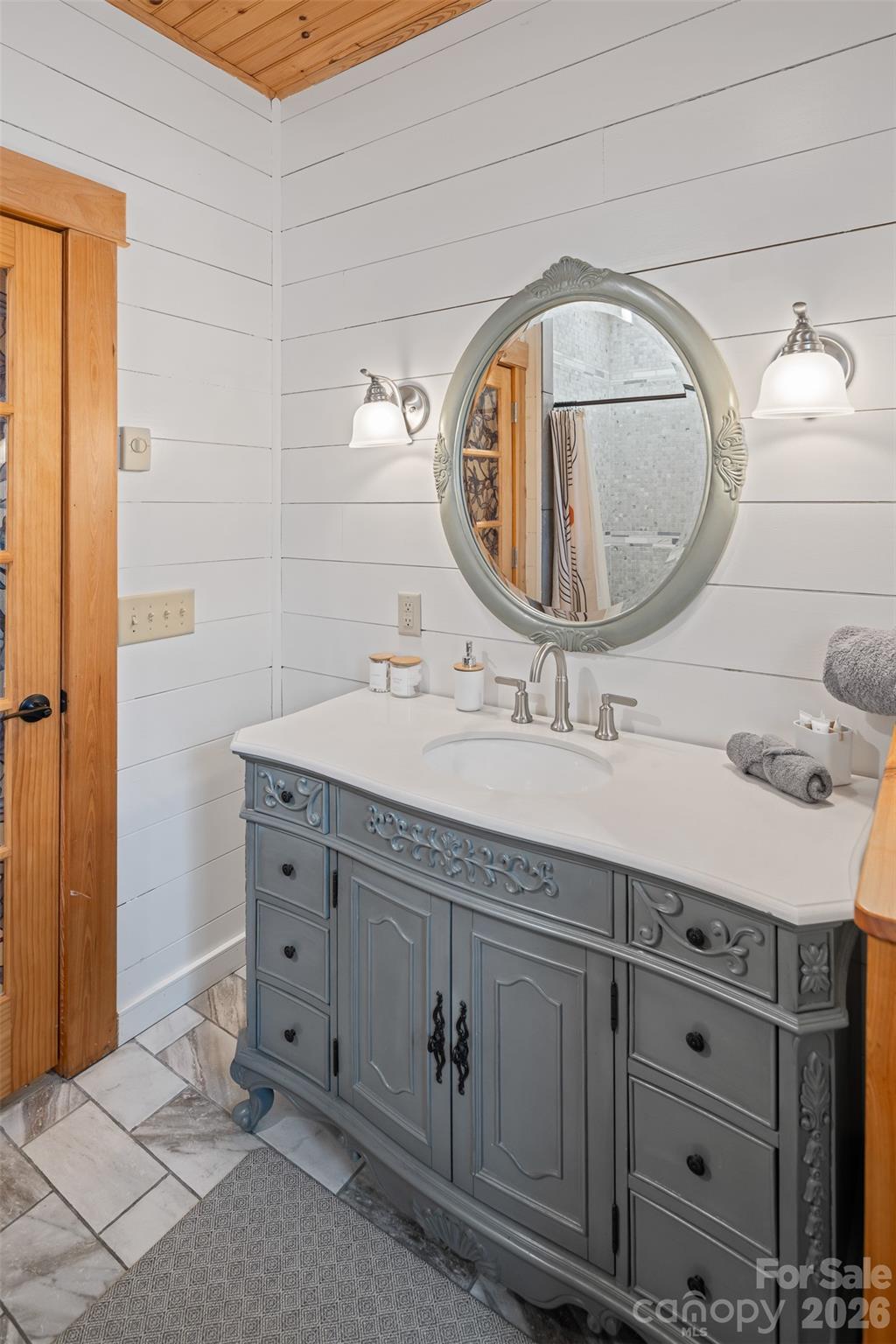 1333 Park Vista Road West Jefferson, NC 28694 - Photo 24 of 39 a bathroom with a double vanity sink and a mirror
