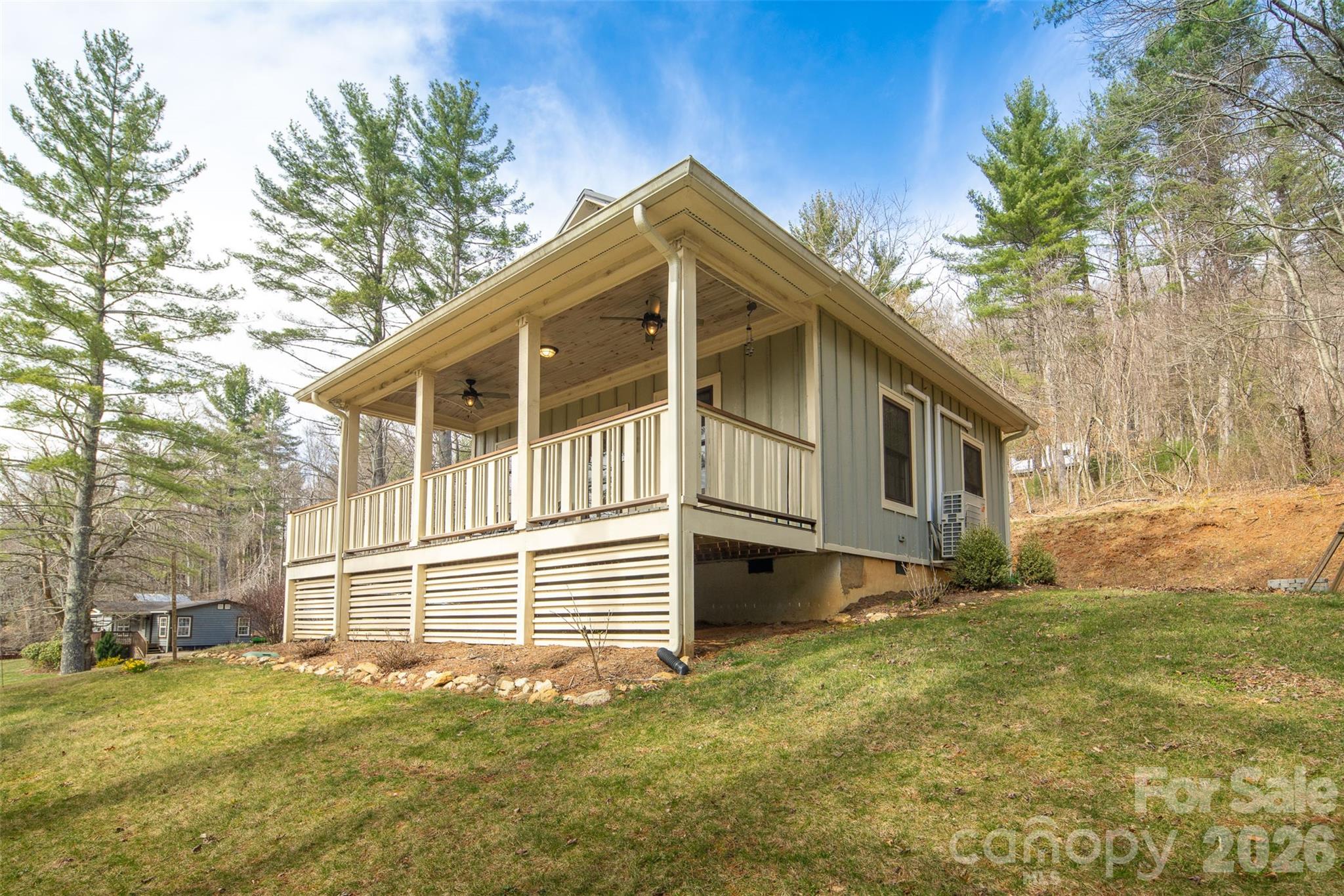 1333 Park Vista Road West Jefferson, NC 28694 - Photo 30 of 39 a house with trees in the background
