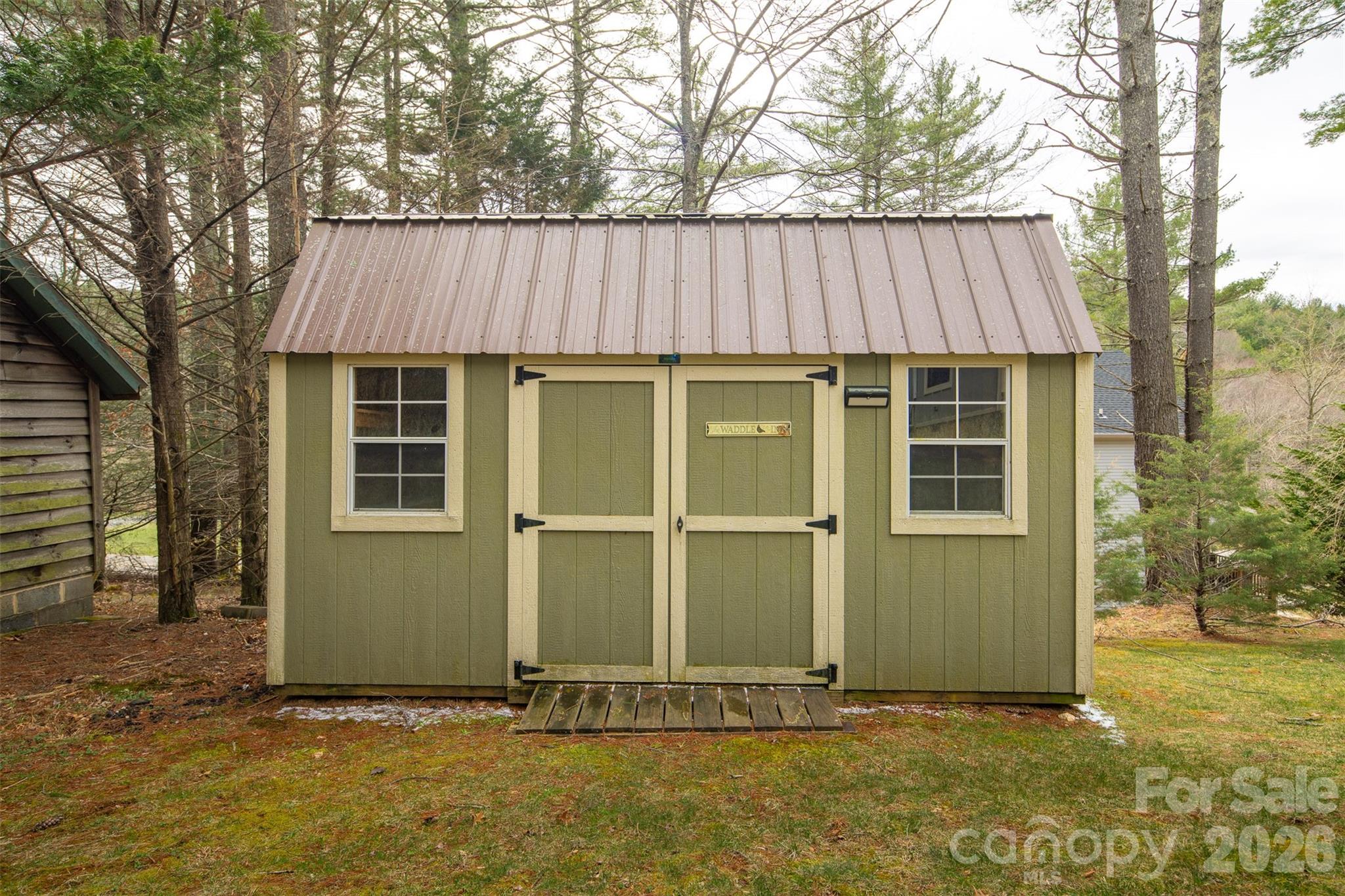 1333 Park Vista Road West Jefferson, NC 28694 - Photo 33 of 39 a front view of a house with a garden