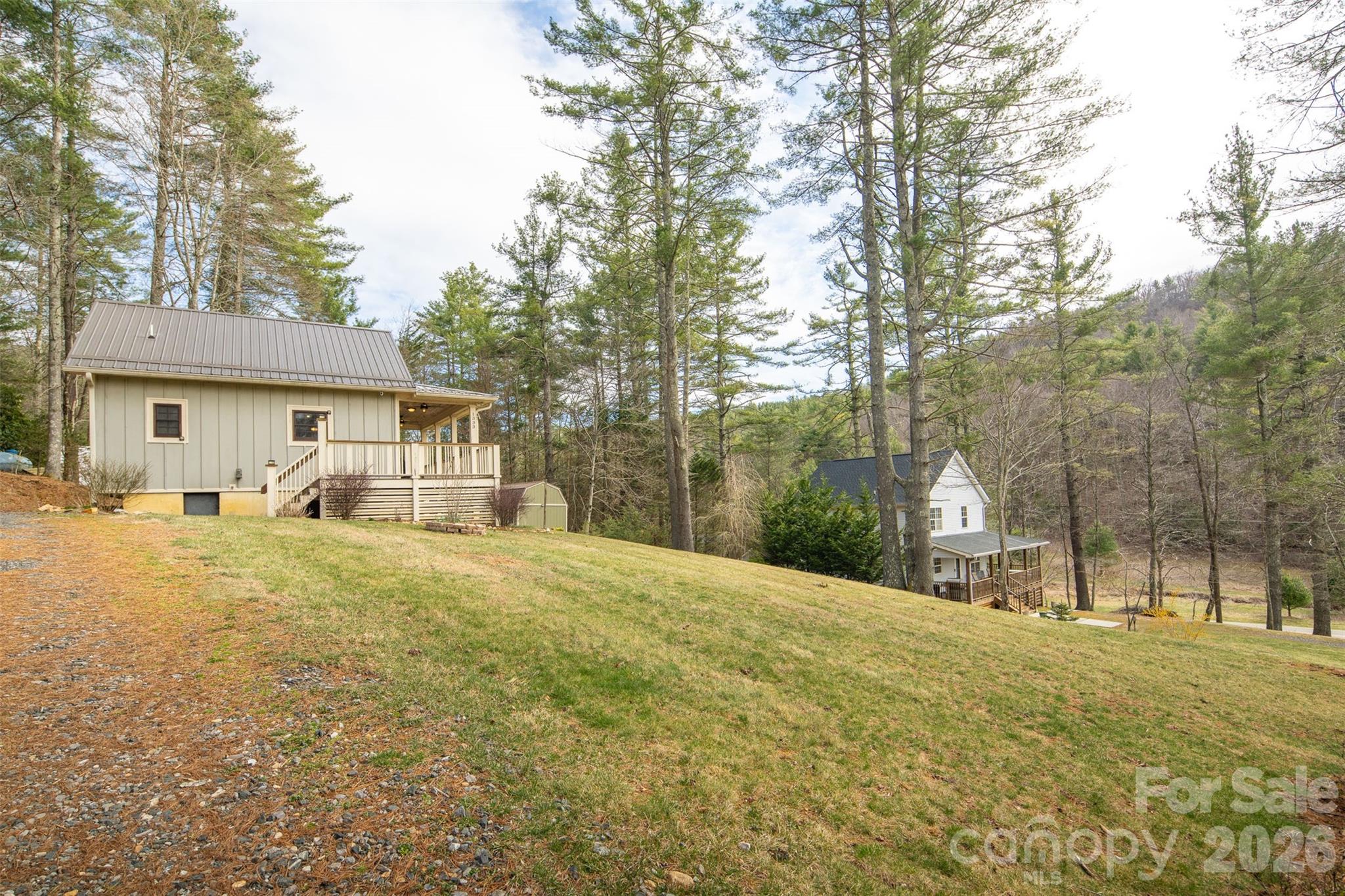 1333 Park Vista Road West Jefferson, NC 28694 - Photo 38 of 39 a front view of a house with a yard garage and outdoor seating