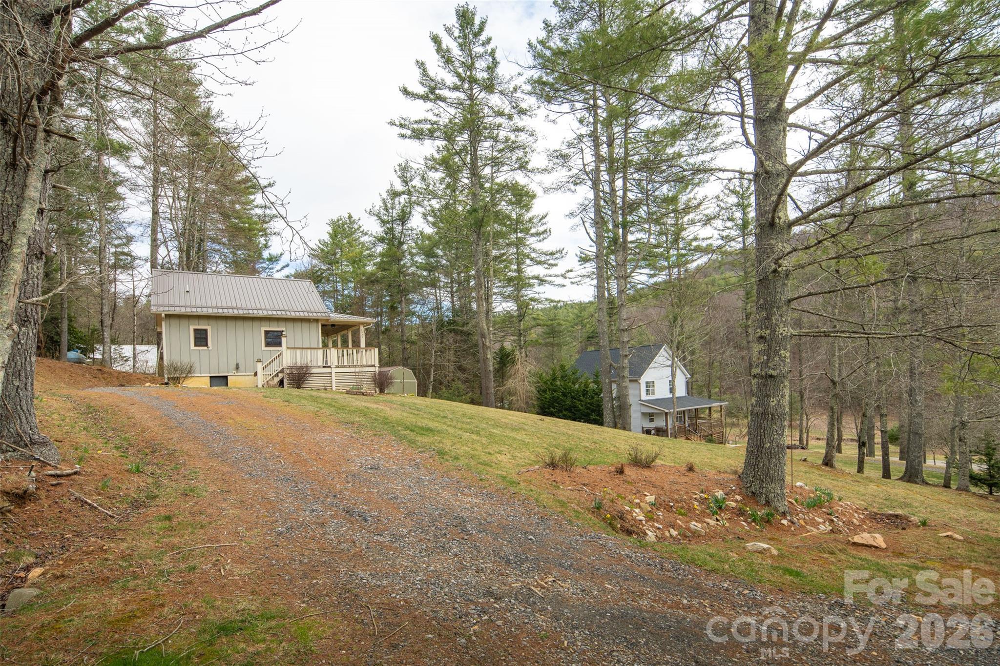 1333 Park Vista Road West Jefferson, NC 28694 - Photo 39 of 39 a front view of a house with a yard and large trees