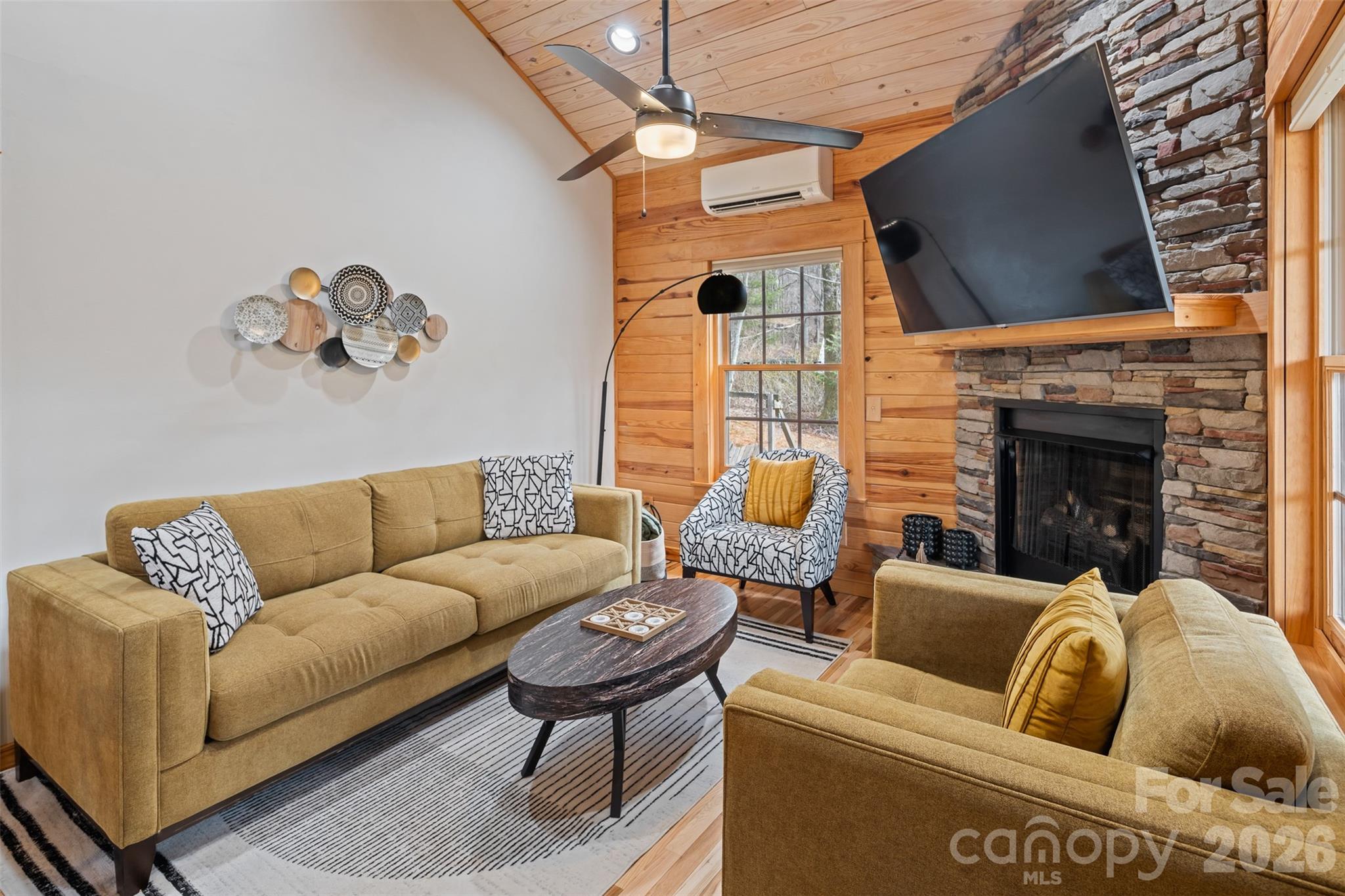 1333 Park Vista Road West Jefferson, NC 28694 - Photo 8 of 39 a living room with furniture a fireplace and a flat screen tv