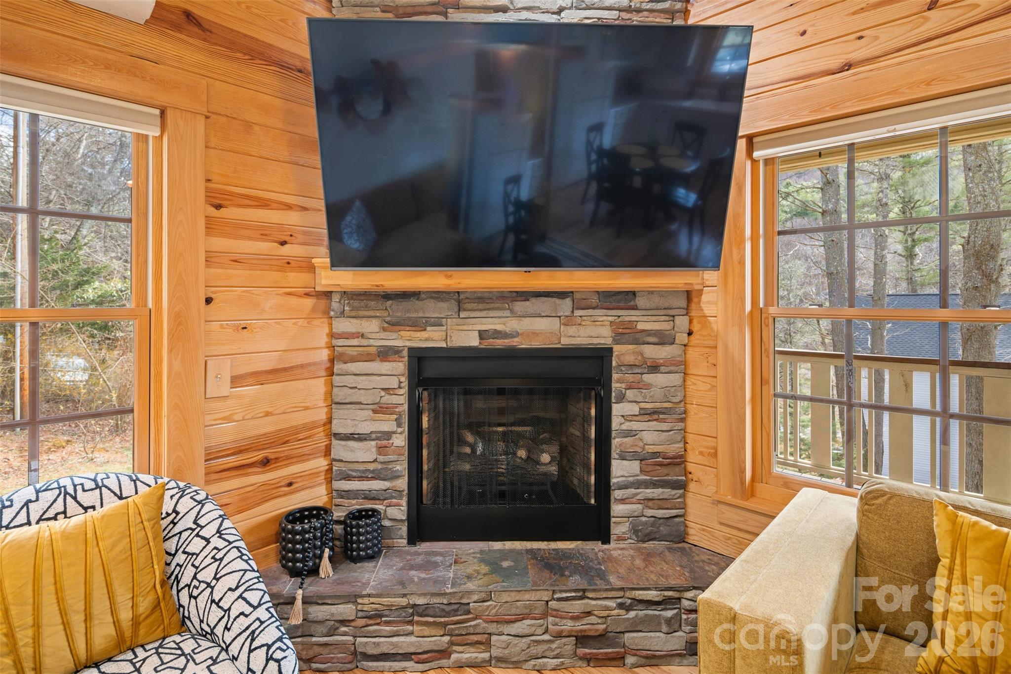 1333 Park Vista Road West Jefferson, NC 28694 - Photo 9 of 39 a living room with a fireplace and a floor to ceiling window