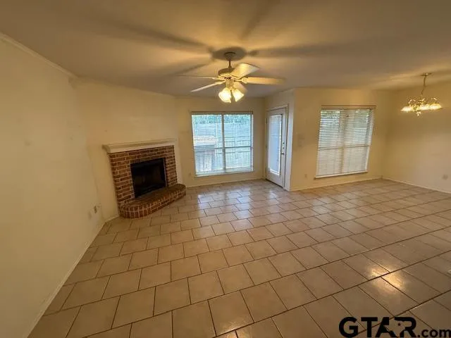 a view of an empty room with glass door