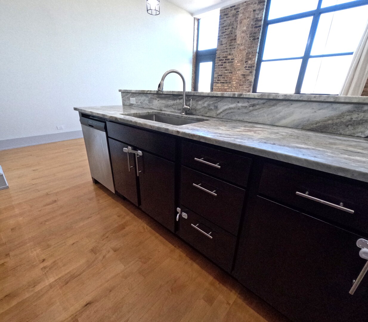 1432 West 21st Street, Unit 321 Chicago, IL 60608 - Photo 13 of 25 a bathroom with a granite countertop sink and a window