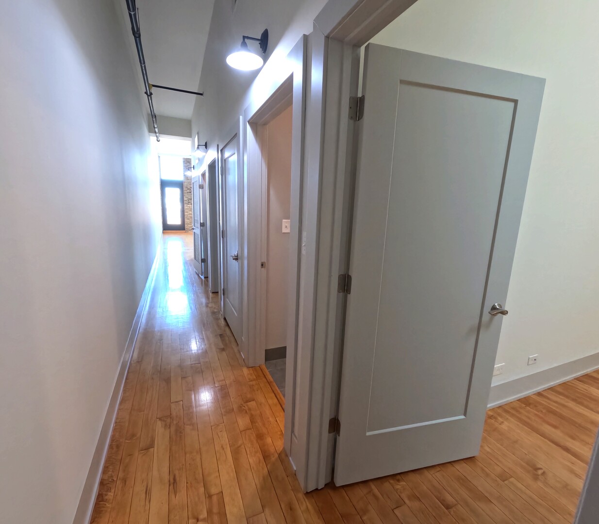 1432 West 21st Street, Unit 321 Chicago, IL 60608 - Photo 2 of 25 a view of gallery with wooden floor