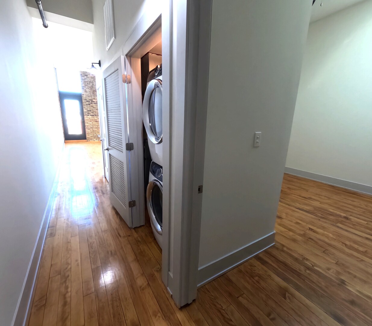1432 West 21st Street, Unit 321 Chicago, IL 60608 - Photo 5 of 25 a view of a hallway with wooden floor