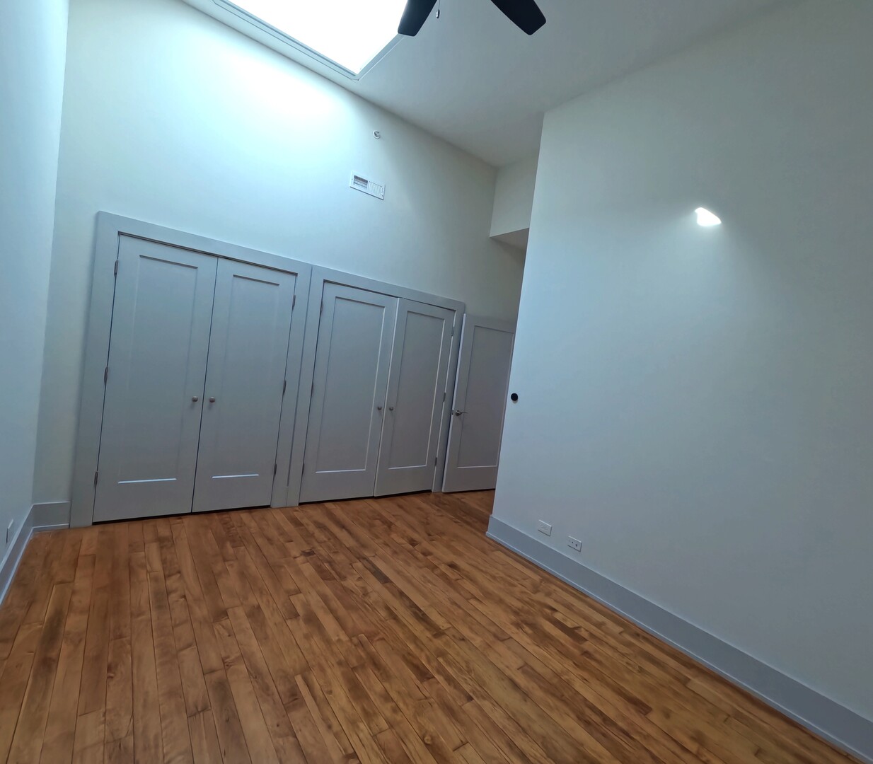 1432 West 21st Street, Unit 321 Chicago, IL 60608 - Photo 7 of 25 a view of an empty room with wooden floor