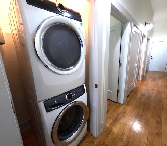 a view of a hallway with washer and dryer