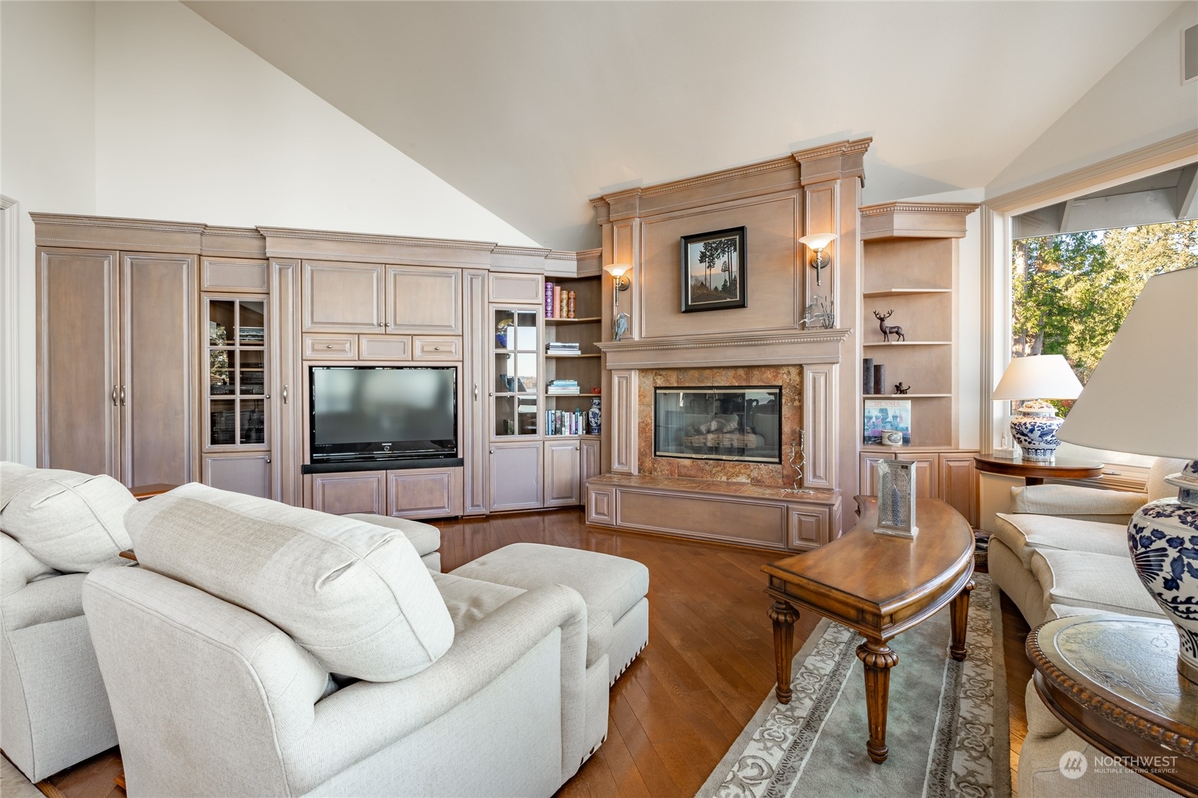 5436 Night Heron Drive Blaine, WA 98230 - Photo 12 of 40 a living room with furniture flat screen tv and a fireplace