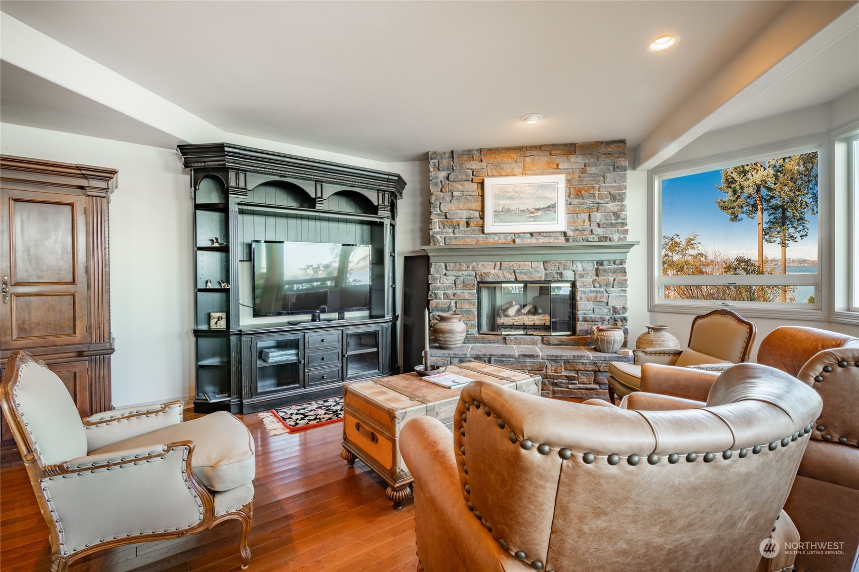 5436 Night Heron Drive Blaine, WA 98230 - Photo 23 of 40 a living room with fireplace furniture and a flat screen tv