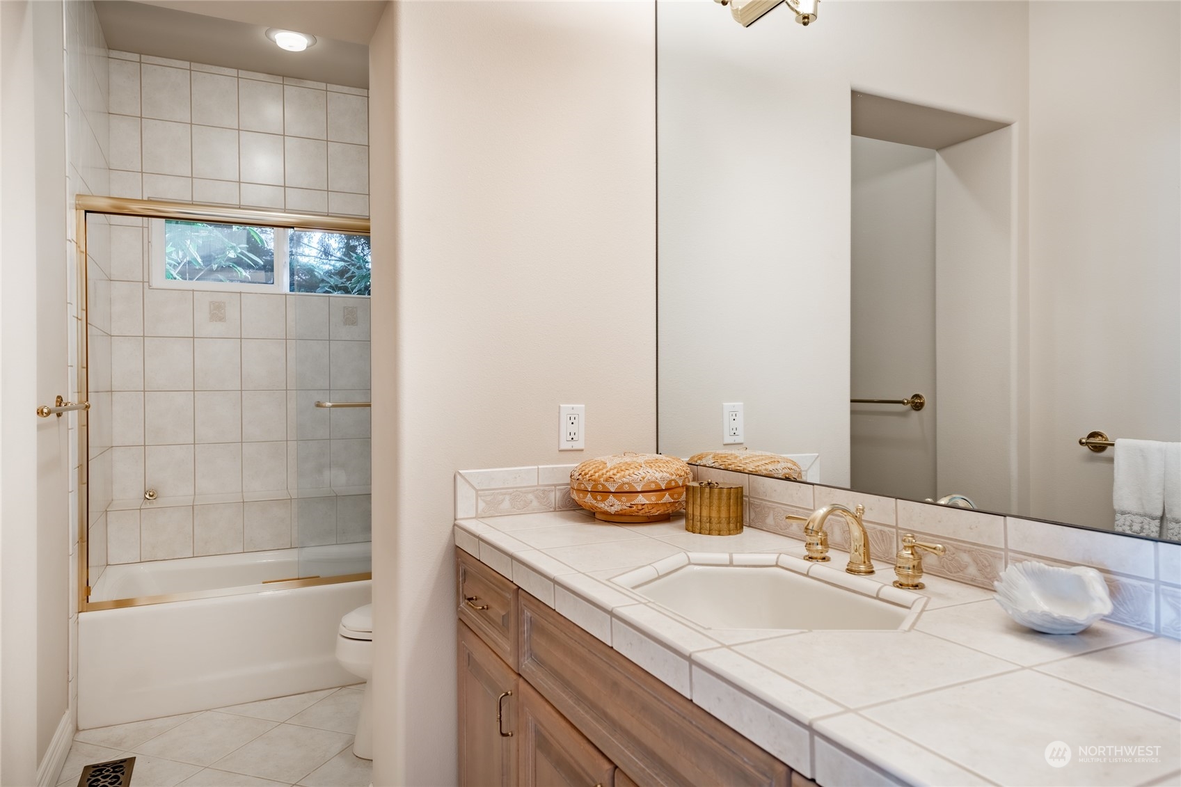 5436 Night Heron Drive Blaine, WA 98230 - Photo 30 of 40 a bathroom with a granite countertop sink and a mirror