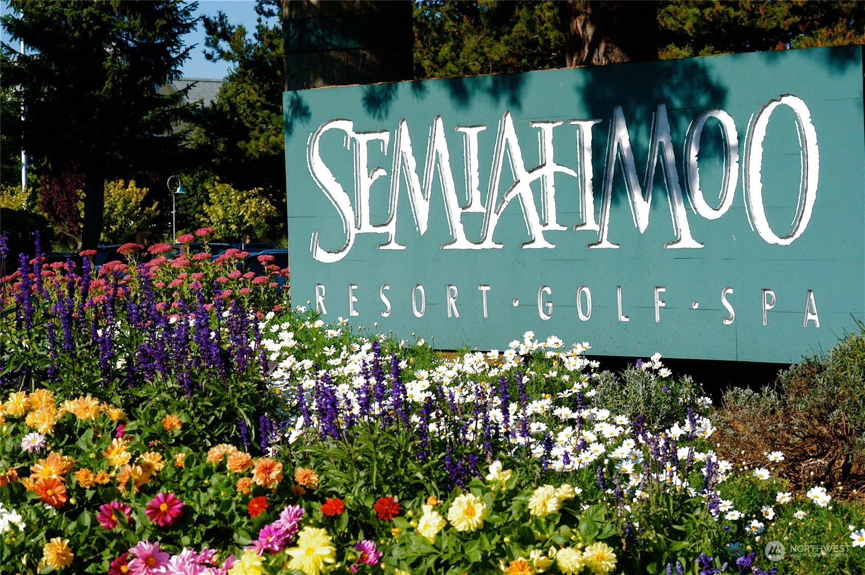 5436 Night Heron Drive Blaine, WA 98230 - Photo 37 of 40 a sign that is sitting in front of flowers