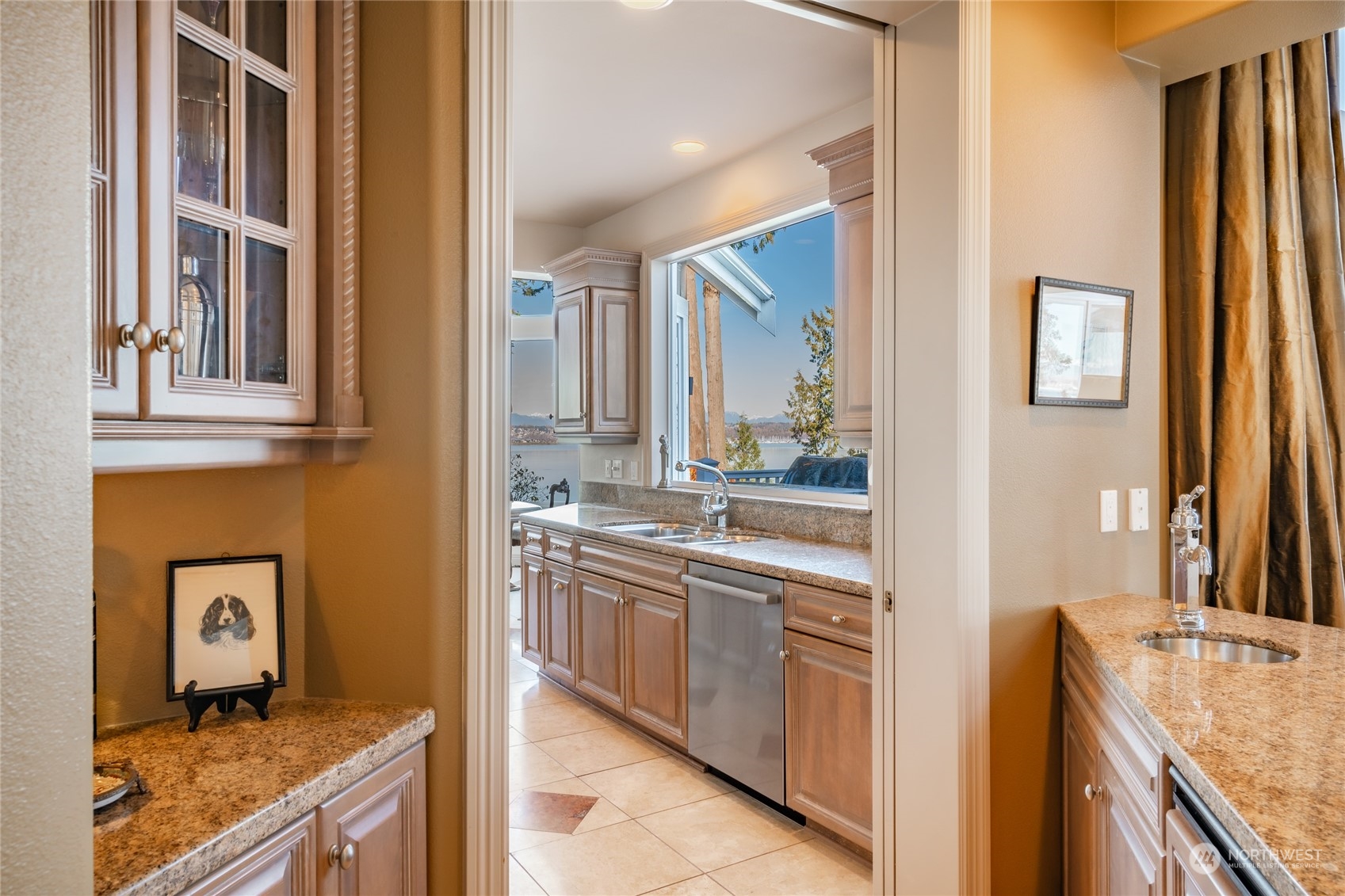 5436 Night Heron Drive Blaine, WA 98230 - Photo 8 of 40 a kitchen with stainless steel appliances granite countertop a sink and a stove next to a refrigerator
