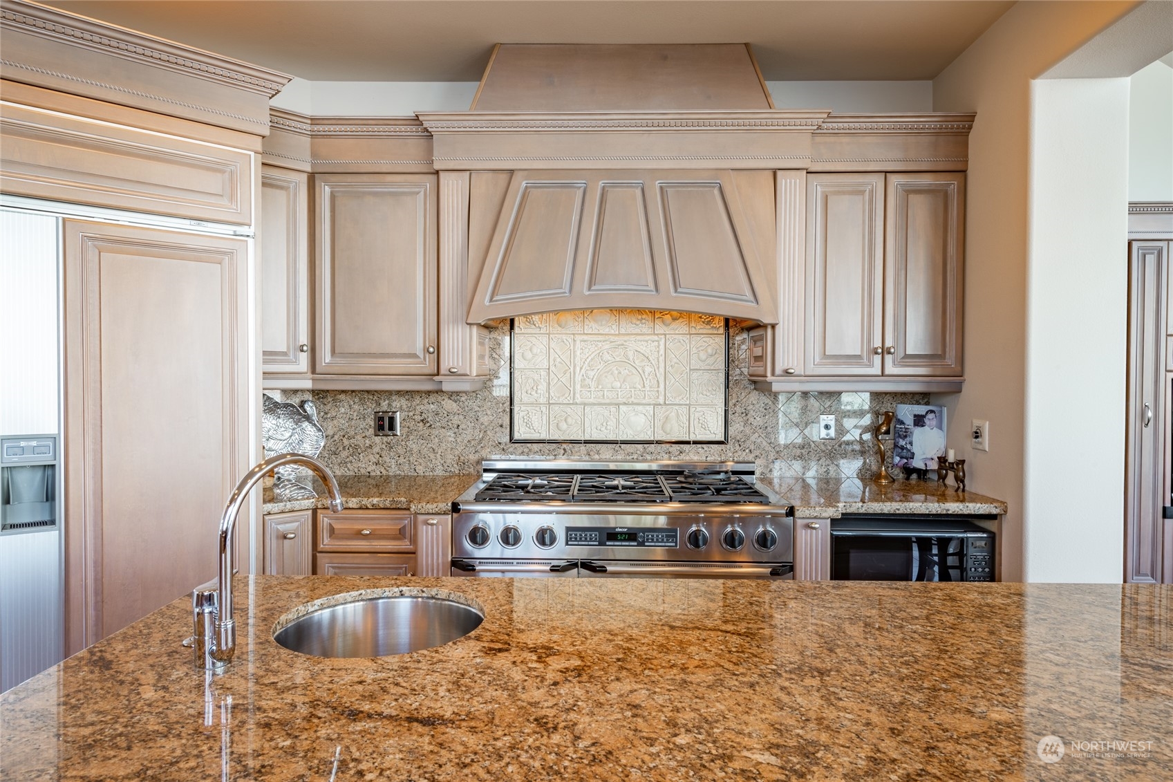 5436 Night Heron Drive Blaine, WA 98230 - Photo 10 of 40 a kitchen with a stove a sink and a cabinets