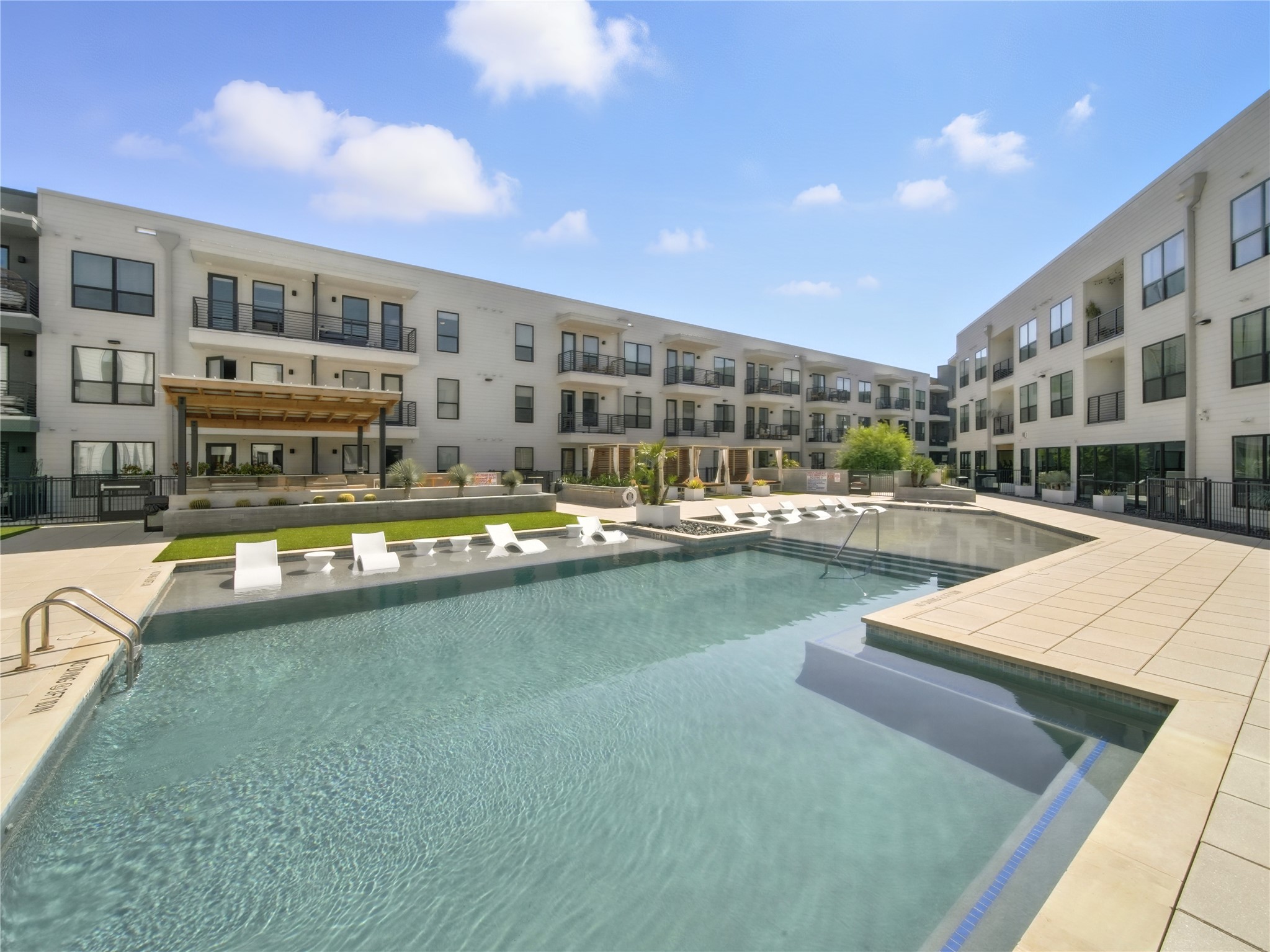 1701 Simond Avenue, Unit 302 Austin, TX 78723 - Photo 18 of 28 a view of swimming pool with outdoor seating