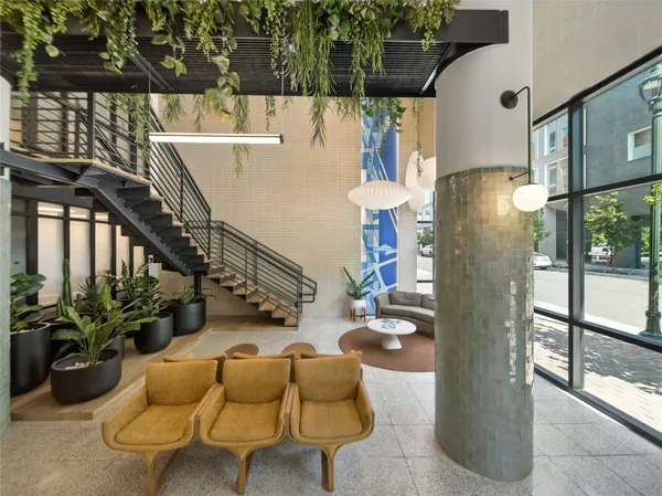 a view of a building with outdoor seating