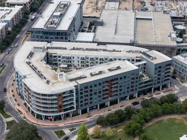 an aerial view of a house with outdoor space