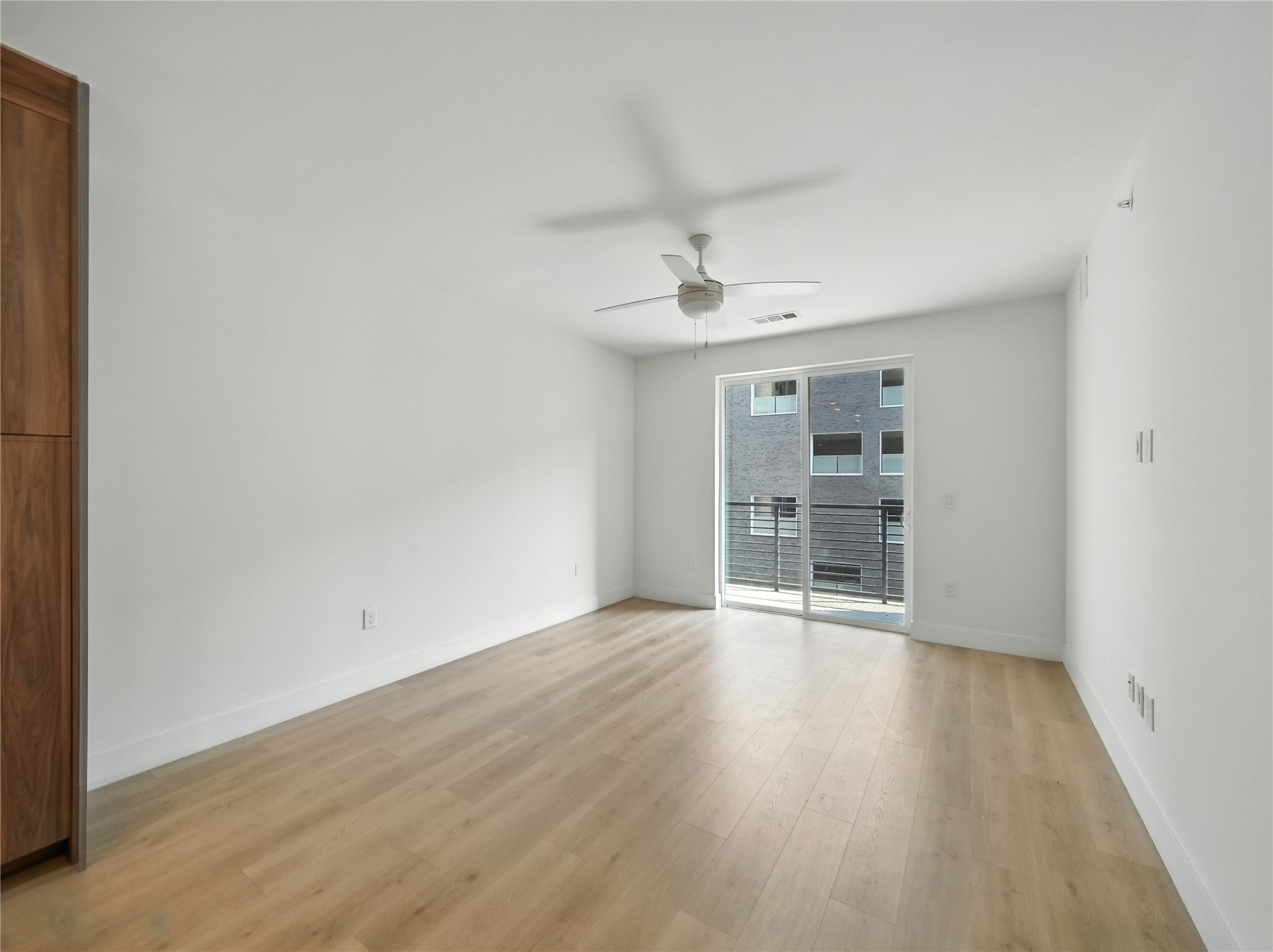 1701 Simond Avenue, Unit 302 Austin, TX 78723 - Photo 6 of 28 wooden floor in an empty room