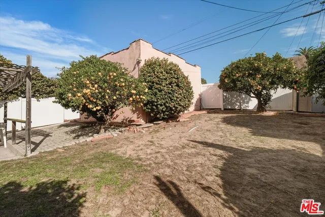a view of a backyard of the house