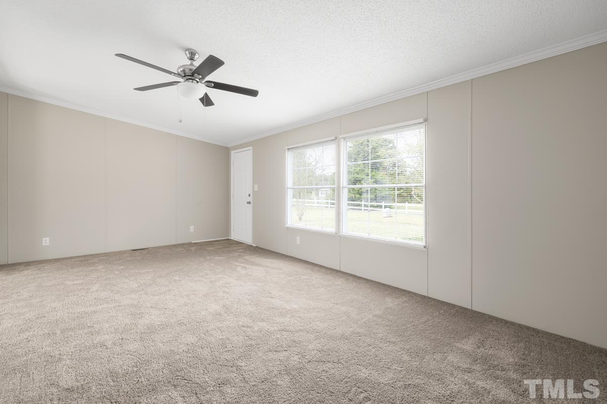 9969 Smith Road Middlesex, NC 27557 - Photo 17 of 19 a view of an empty room with a window