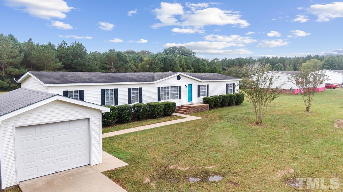 9969 Smith Road Middlesex, NC 27557 - Photo 8 of 19 a view of a house with a yard