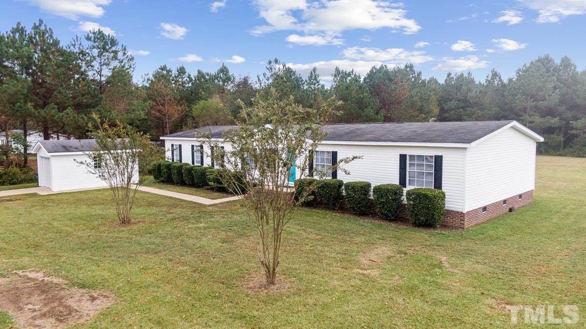 9969 Smith Road Middlesex, NC 27557 - Photo 9 of 19 a view of a house with pool and a yard