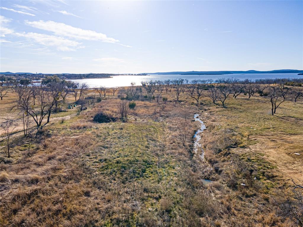 Lot 932 Frog Branch Graford, TX 76449 - Photo 15 of 25 Aerial view featuring a water view and a rural view
