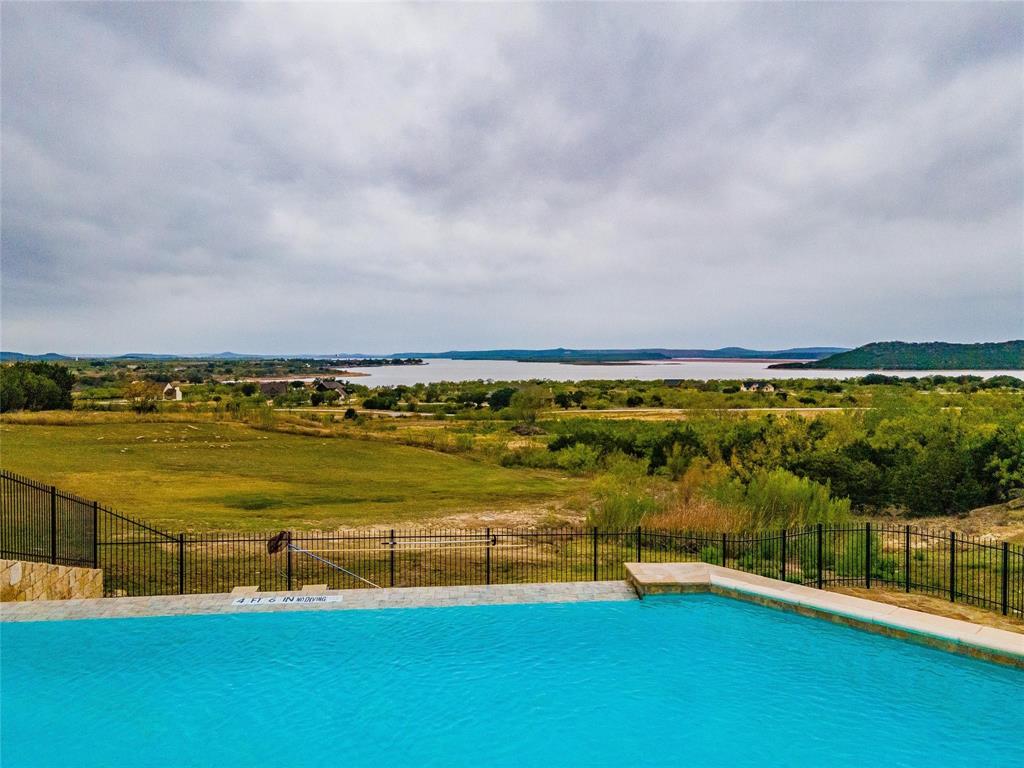 Lot 932 Frog Branch Graford, TX 76449 - Photo 22 of 25 View of swimming pool with a water and mountain view