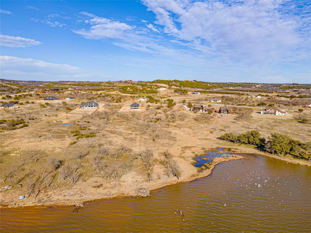Lot 932 Frog Branch Graford, TX 76449 - Photo 7 of 25 Birds eye view of property featuring a water view