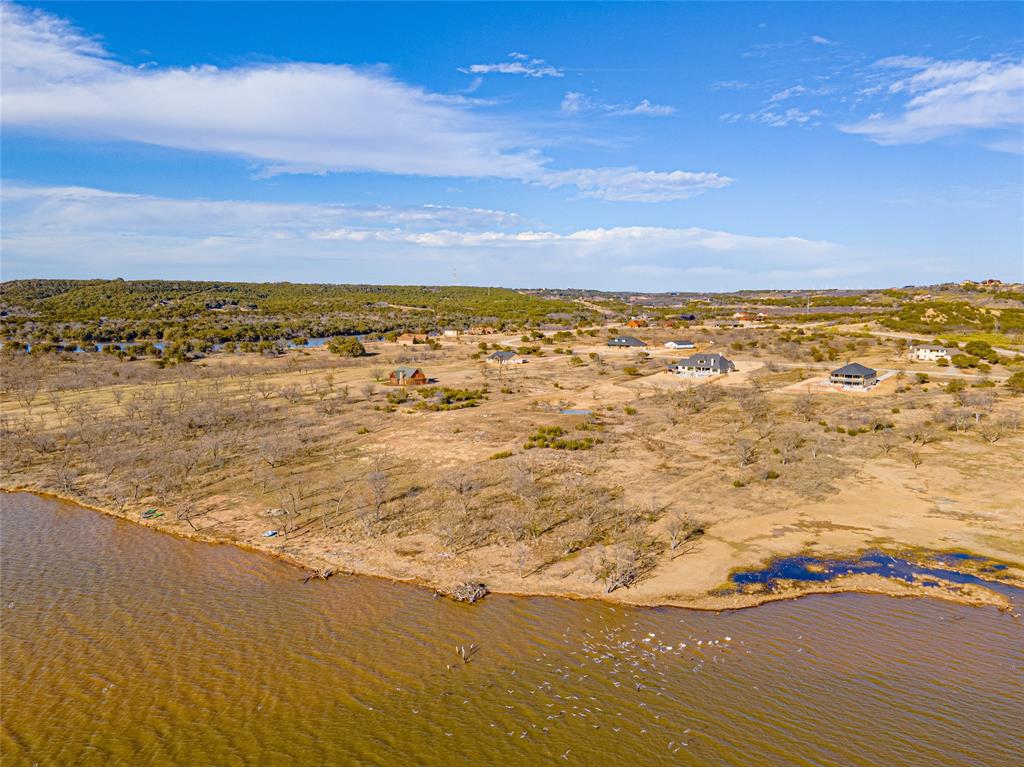 Lot 932 Frog Branch Graford, TX 76449 - Photo 8 of 25 Drone / aerial view with a water view