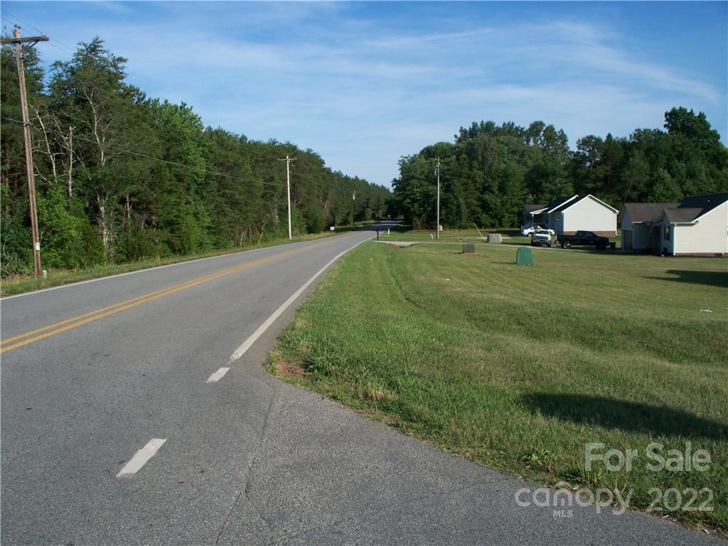 0 Shoal Road, Unit 6 Crouse, NC 28033 - Photo 6 of 6 a view of a green field with a house in the background