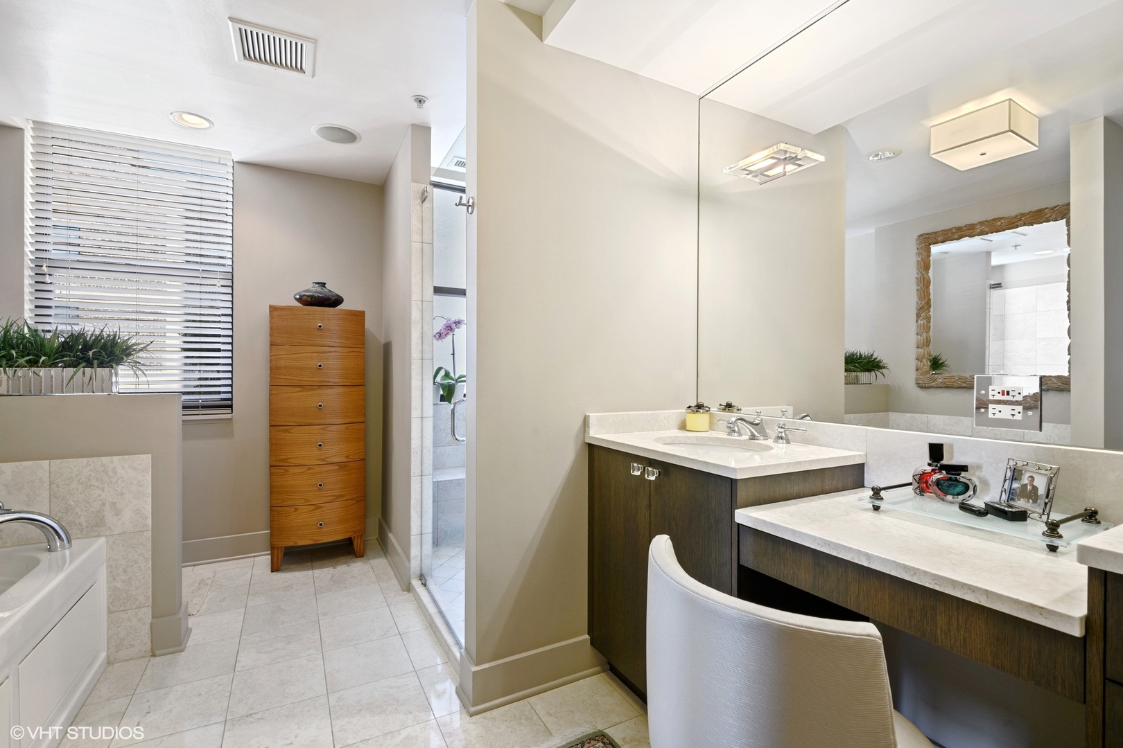 1155 North Dearborn Street, Unit 1003 Chicago, IL 60610 - Photo 14 of 28 a bathroom with a sink and mirror