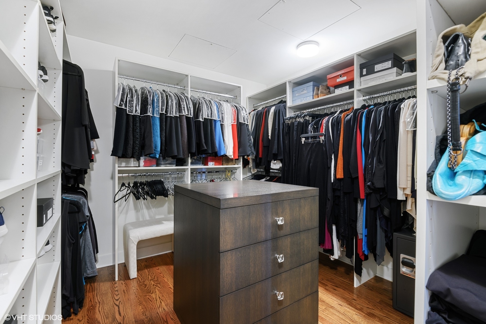 1155 North Dearborn Street, Unit 1003 Chicago, IL 60610 - Photo 15 of 28 a view of walk in closet with clothes and shoes