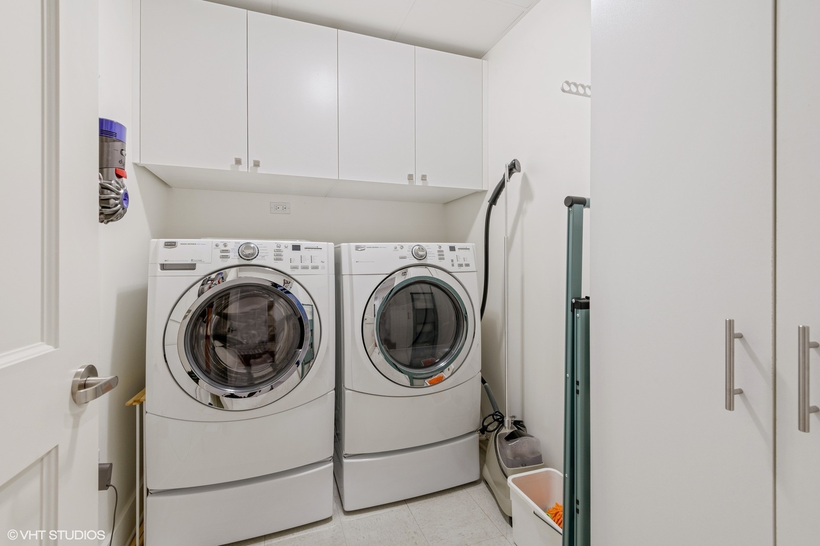 1155 North Dearborn Street, Unit 1003 Chicago, IL 60610 - Photo 18 of 28 a utility room with dryer and washer