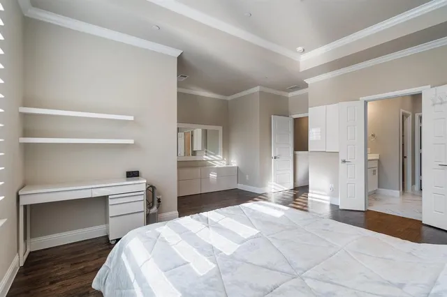 a bedroom with a bed and a cabinets