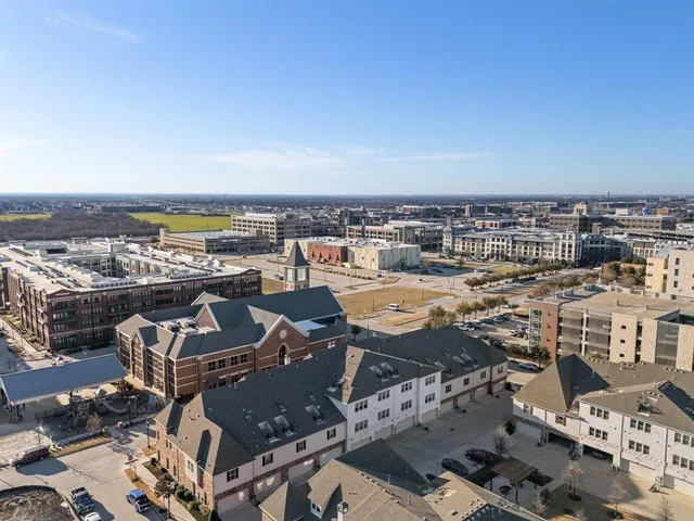 an aerial view of a city with ocean view