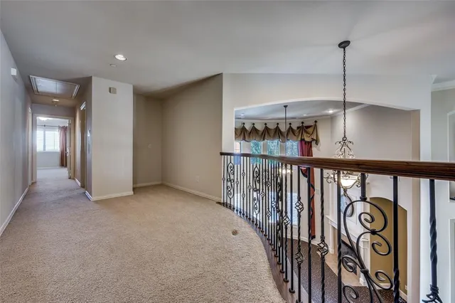 a view of a hallway with stairs