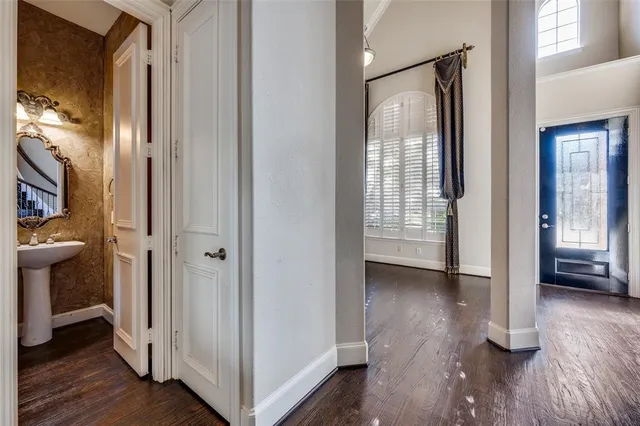a view of an empty room and wooden floor