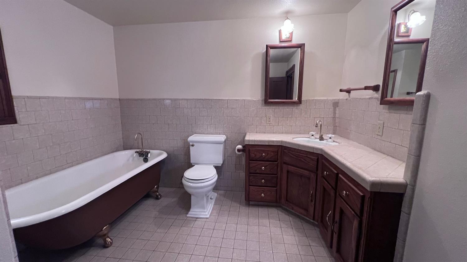 6375 Murphy Avenue Laton, CA 93242 - Photo 16 of 68 a bathroom with a sink a toilet and mirror